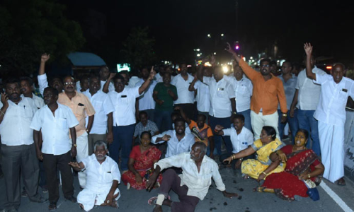 ரெயில்வே பாலத்தை ரிப்பன் வெட்டி திறந்த அ.தி.மு.க மாவட்ட செயலாளர் ஜெயிலில் அடைப்பு- சாலை மறியல்