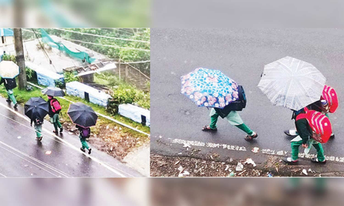 கொடைக்கானலில் விடிய விடிய மழை விடுமுறை அறிவிப்பதில் குளறுபடியால் மாணவ-மாணவிகள் தவிப்பு