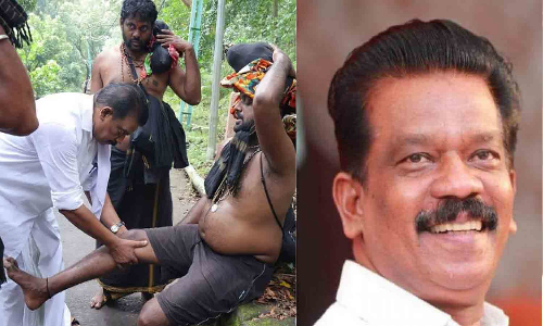 காலில் தசைப்பிடிப்பால் அவதிப்பட்ட பக்தருக்கு முதலுதவி அளித்த கேரள மந்திரி