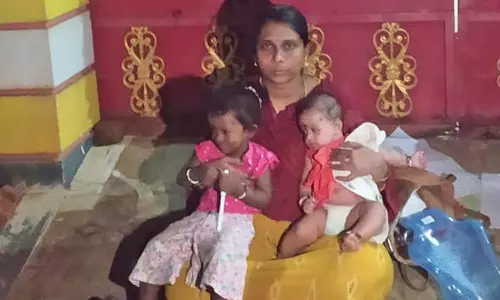 பாவூர்சத்திரத்தில் கணவர் வீட்டு முன்பு 2 குழந்தைகளுடன் பெண் தர்ணா