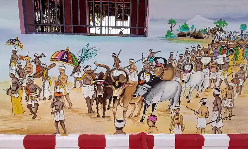 திண்டுக்கல் அருகே ஏறு தழுவுதல் நிகழ்ச்சியை விளக்கி வரையப்பட்டுள்ள சுவர் ஓவியம்