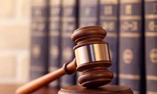 கோர்ட்டில் ஆஜர் ஆகாத வாலிபருக்கு பிடிவாரண்டு