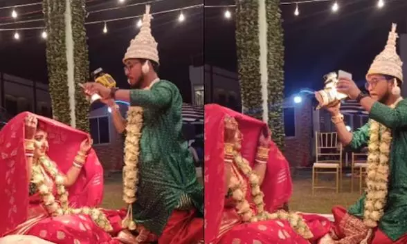 தனது திருமணத்தில் மணமகளை போட்டோ எடுத்த புகைப்படக்காரர் தனது திருமணத்தில் மணமகளை போட்டோ எடுத்த புகைப்படக்காரர்