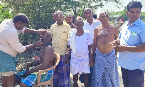 பரந்தூரில் புதிய விமான நிலையம் அமைக்க எதிர்ப்பு- ஏகனாபுரத்தில் மொட்டையடித்து கிராம மக்கள் நூதன போராட்டம்