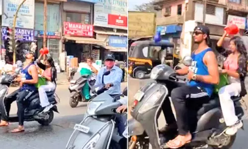 மொபட்டில் குளித்தபடி சென்ற வாலிபர்- இளம்பெண்