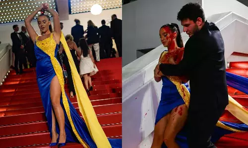 உக்ரைன் கொடி நிறத்தில் ஆடை.. உடல் முழுவதும் ரத்தம்.. கேன்ஸ் திரைப்பட விழாவில் பரபரப்பை ஏற்படுத்திய பெண்