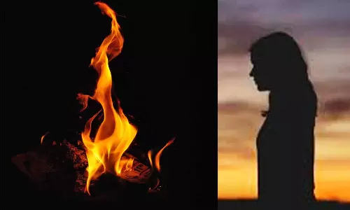 பெண் தீக்குளிக்க முயற்சி