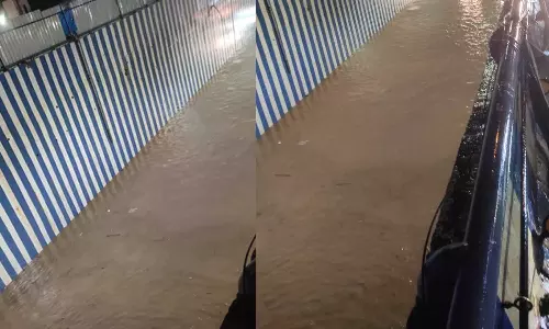 பெங்களூருவில் கொட்டி தீர்த்த கன மழை- தெருவே ஆறுபோல மாறியது