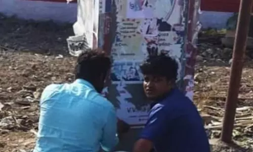 தி.மு.க.கல்வெட்டில் பா.ஜ.க.வினர் போஸ்டர்