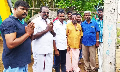 சாலை பணிக்கு பூமி பூஜை