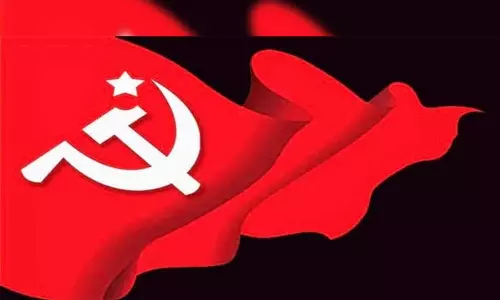 நிறுத்தப்பட்ட ெரயில்களை முழுமையாக இயக்கக்கோரி திருப்பூரில் கம்யூனிஸ்ட் கட்சியினர் ஆர்ப்பாட்டம்