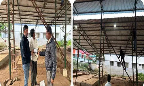 கொடைக்கானல் வாரச்சந்தையில் எல்.இ.டி. பல்ப்புகள் பொருத்தும் பணி