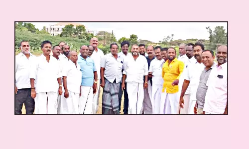முதல்-அமைச்சர் வருகை: ஹெலிபேட் தளத்தில் துப்புரவு பணிகள்