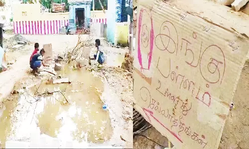 சிறுவர்கள் அட்டையில் எழுதி வாகன ஓட்டிகளுக்கு எச்சரிக்கை