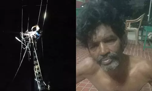 மின் கம்பத்தில் ஏறி விடிய, விடிய ரகளையில் ஈடுபட்ட தொழிலாளி- மதுபோதையில் அட்டகாசம்