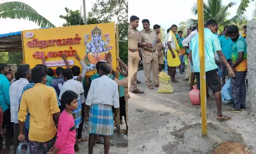 ஊர் முகப்பில் போர்டு வைப்பதில் இருதரப்பினரிடையே தகராறு- அதிகாரியை முற்றுகையிட்ட கிராம மக்கள்