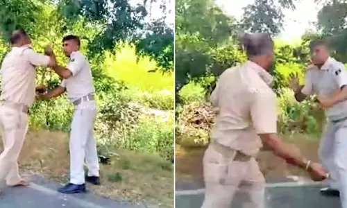 நடுரோட்டில் சண்டை போட்ட போலீஸ்காரர்கள்