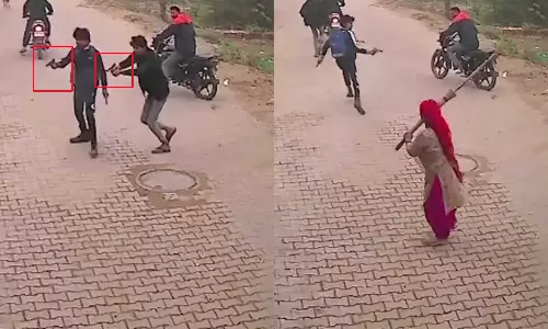 துப்பாக்கியால் சுட்டவர்களை துடைப்பக்கட்டையால் துரத்திய பெண்..