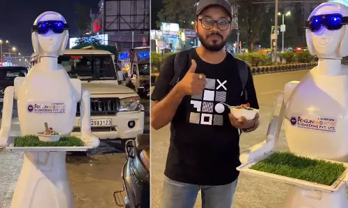 தெருவோர ஓட்டலில் வாடிக்கையாளர்களுக்கு சேவை செய்யும் ரோபோ