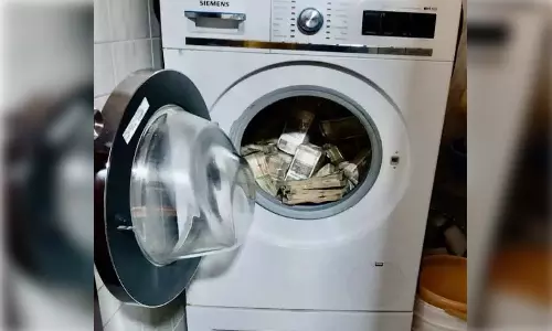 வாஷிங் மெஷினில் கட்டுக்கட்டாக பணம்- 2.54 கோடி ரூபாயை பறிமுதல் செய்தது அமலாக்கத்துறை