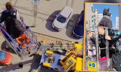 மருமகளை கிரேனில் வைத்து 7-வது மாடிக்கு அழைத்து சென்ற மாமியார்