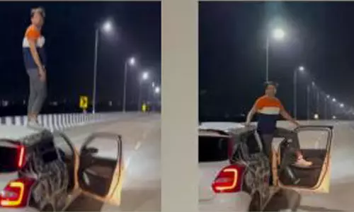 ஓடும் காரில் ஆபத்தான சாகசம் செய்த வாலிபர்- வீடியோ வைரல்
