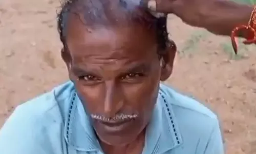 அ.தி.மு.க. ஒன்றிணைய மொட்டையடித்துக்கொண்ட தொண்டர்