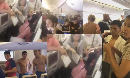 கத்தார் விமானத்தில் ஏசி பழுது: வியர்வையால் நனைந்ததால் மேலாடைகளை கழற்றிய பயணிகள்- வீடியோ