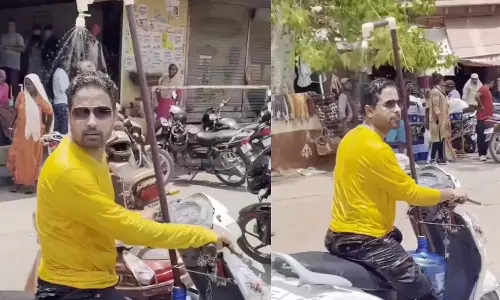 ஸ்கூட்டரில் ஷவர் பொருத்திய வாலிபர்- வைரல் வீடியோ