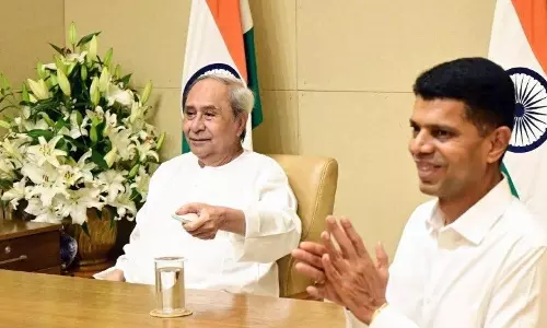 Naveen Patnaik with Pandian