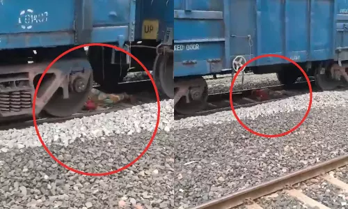 திடீரென வந்த சரக்கு ரெயில்... தண்டவாளத்தில் படுத்து உயிர் தப்பிய பெண்: வைரலாகும் வீடியோ