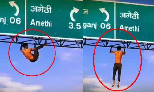 P Man Takes Reel On Highway Signboard