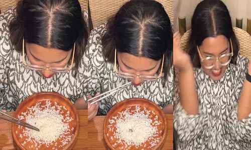 சாப்ஸ்டிக்ஸ்-ல் அரிசியை சாப்பிட்டு உலக சாதனை படைத்த பெண்- வீடியோ