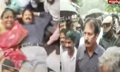 கிருஷ்ணசாமி சாலையில் படுத்து போராட்டம் நடத்தியதால் பரபரப்பு