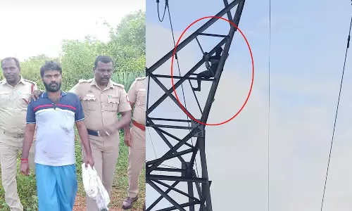 உயர் மின்னழுத்த கோபுரத்தில் ஏறி வாலிபர் தர்ணா