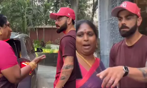 கோலியை இழுத்துப் பிடித்து செல்பி எடுத்த பெண் - வீடியோ வைரல்