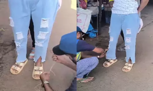 கிழிந்த நிலை பேஷன் பேண்டை ஊசியால் தைத்ததால் வாலிபர் தற்கொலை முயற்சி- வீடியோ வைரல் ஆனதால் விபரீதம்