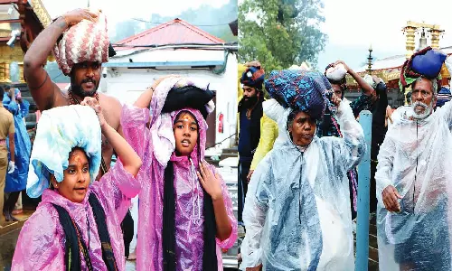 சபரிமலையில் பலத்த மழை: பக்தர்கள் பம்பை ஆற்றில் இறங்க தடை