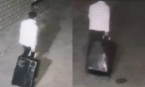 காங்கிரஸ் பிரமுகர் உடலை சூட்கேசில் வைத்து இழுத்துச் செல்லும் கொலையாளி - அதிர்ச்சி வீடியோ