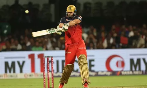 டிம் டேவிட் அரை சதம்: பஞ்சாப் வெற்றி பெற 96 ரன்களை இலக்காக நிர்ணயித்தது பெங்களூரு