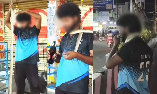 கழுத்தில் பாம்பை போட்டு கொண்டு டாஸ்மாக் கடைக்கு வந்த வாலிபர்- மதுபிரியர்கள் அலறி அடித்து ஓட்டம்