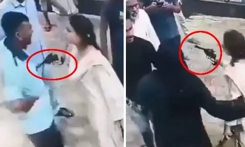 பெட்ரோல் பங்க்கில் தகராறு: துப்பாக்கியை காட்டி மிரட்டிய பெண் - வைரல் வீடியோ