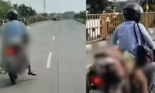 VIDEO: லாரி மோதி உயிரிழந்த மனைவியின் உடலை பைக்கில் கட்டி கொண்டு சென்ற கணவர்