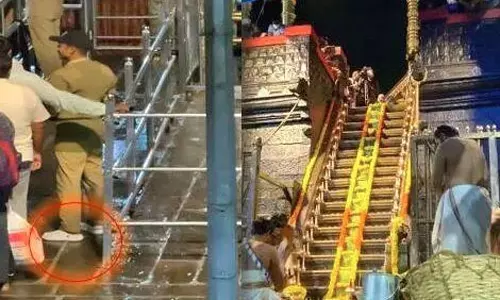 சபரிமலை கோவிலில் காலணி அணிந்து சென்ற போலீஸ் அதிகாரி மீது நடவடிக்கை