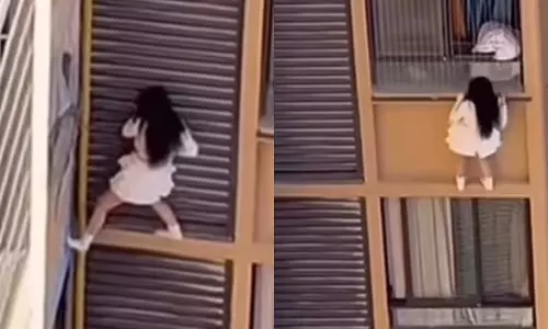 சட்டென வீடு திரும்பிய மனைவி... தப்பிக்க 10-வது மாடி பால்கனியில் இருந்து தொங்கிய கள்ளக்காதலி